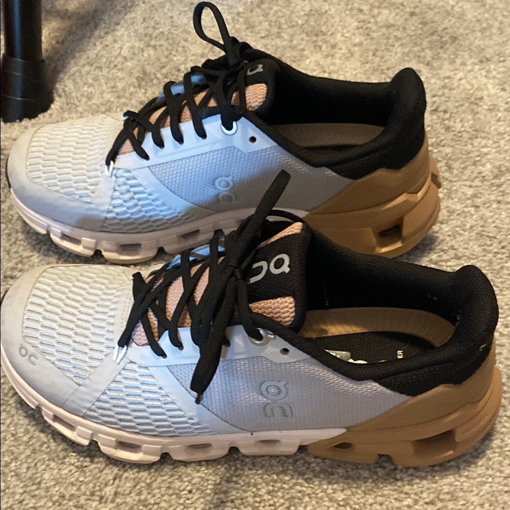 On Running White and Tan Athletic Shoes